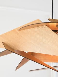 Geometric Wood Lamp with layered natural wood design and warm lighting.