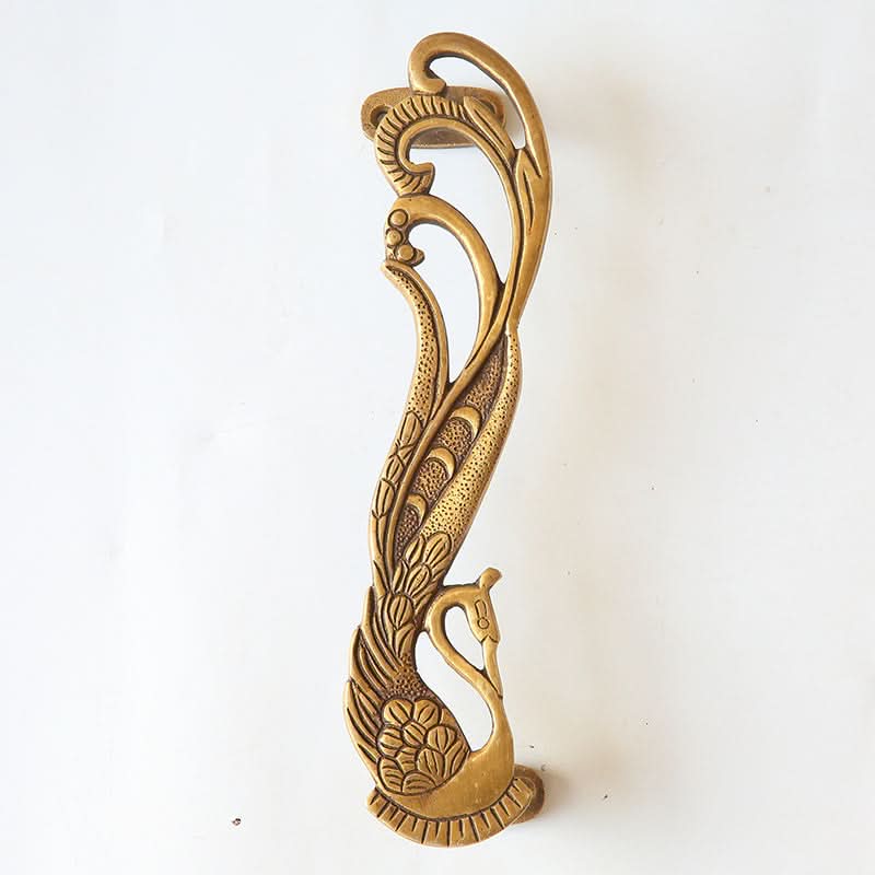 Antique brass Phoenix double door handle with ornate peacock design, handmade home decor.