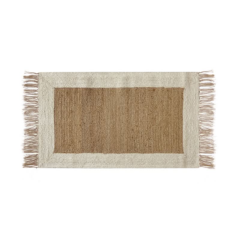 Natural jute rug with navy stripes and fringe border, home decor.