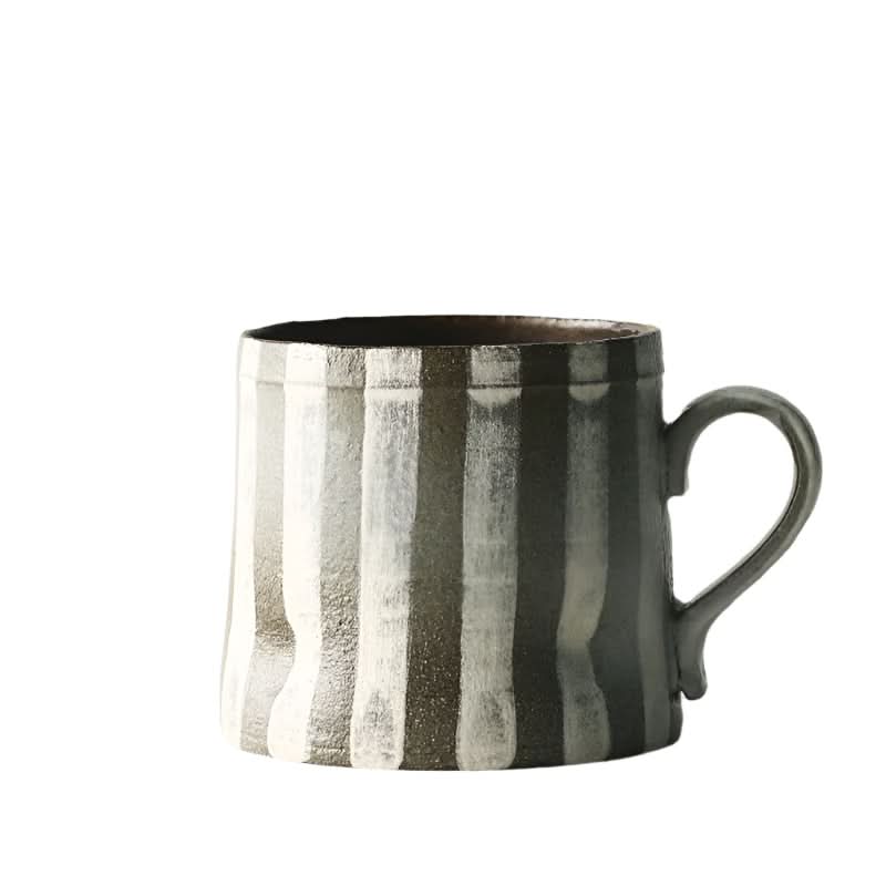 Rustic ceramic coffee cup with vertical grey and white stripes, part of our unique handcrafted home decor collection.