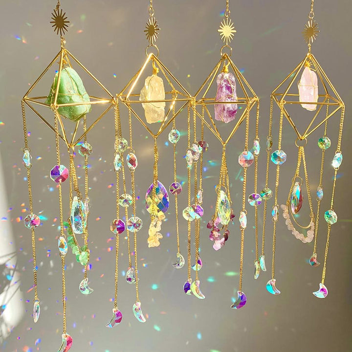 Gold geometric sun catcher with rainbow crystal prisms and moon charms.
