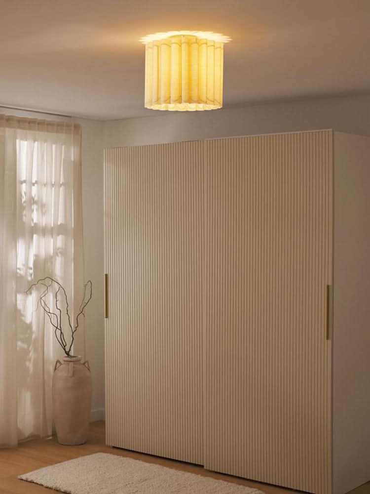 Modern Pleated Fabric Pendant Light in a beige room with curtains and a wardrobe.