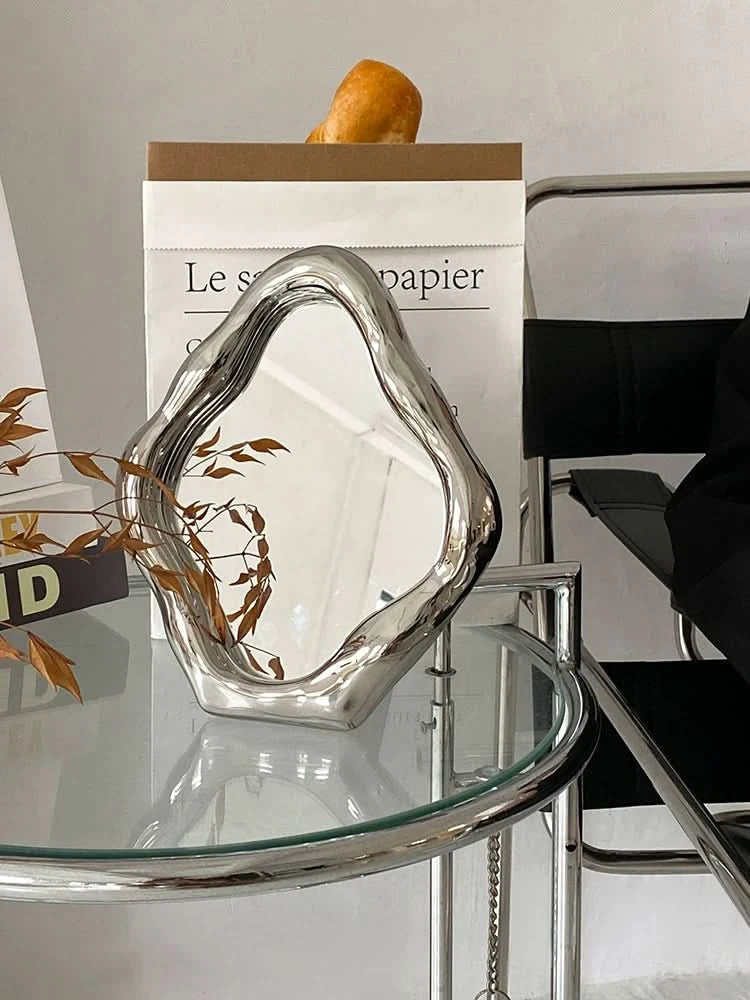 Modern Abstract Metal Vanity Mirror in silver, a unique desk decor piece.