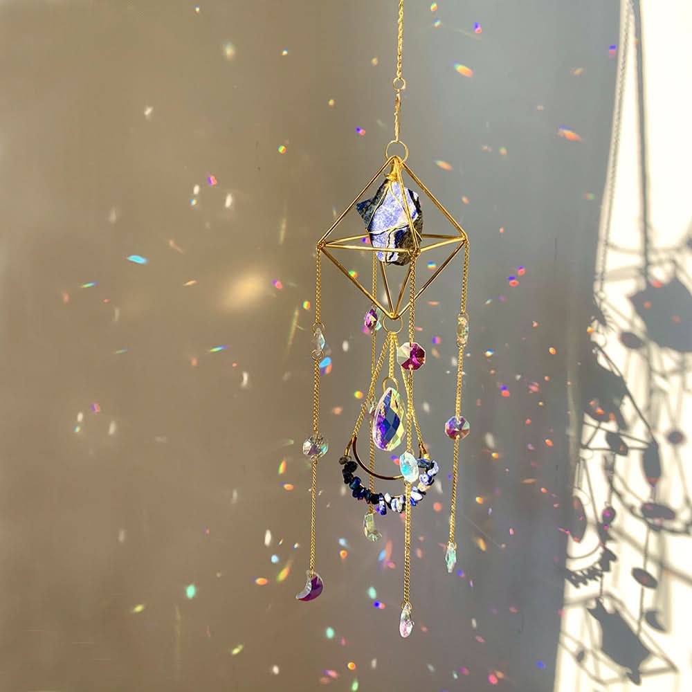 Gold crystal diamond sun catcher with prisms, moon charms, and rainbow light reflections.