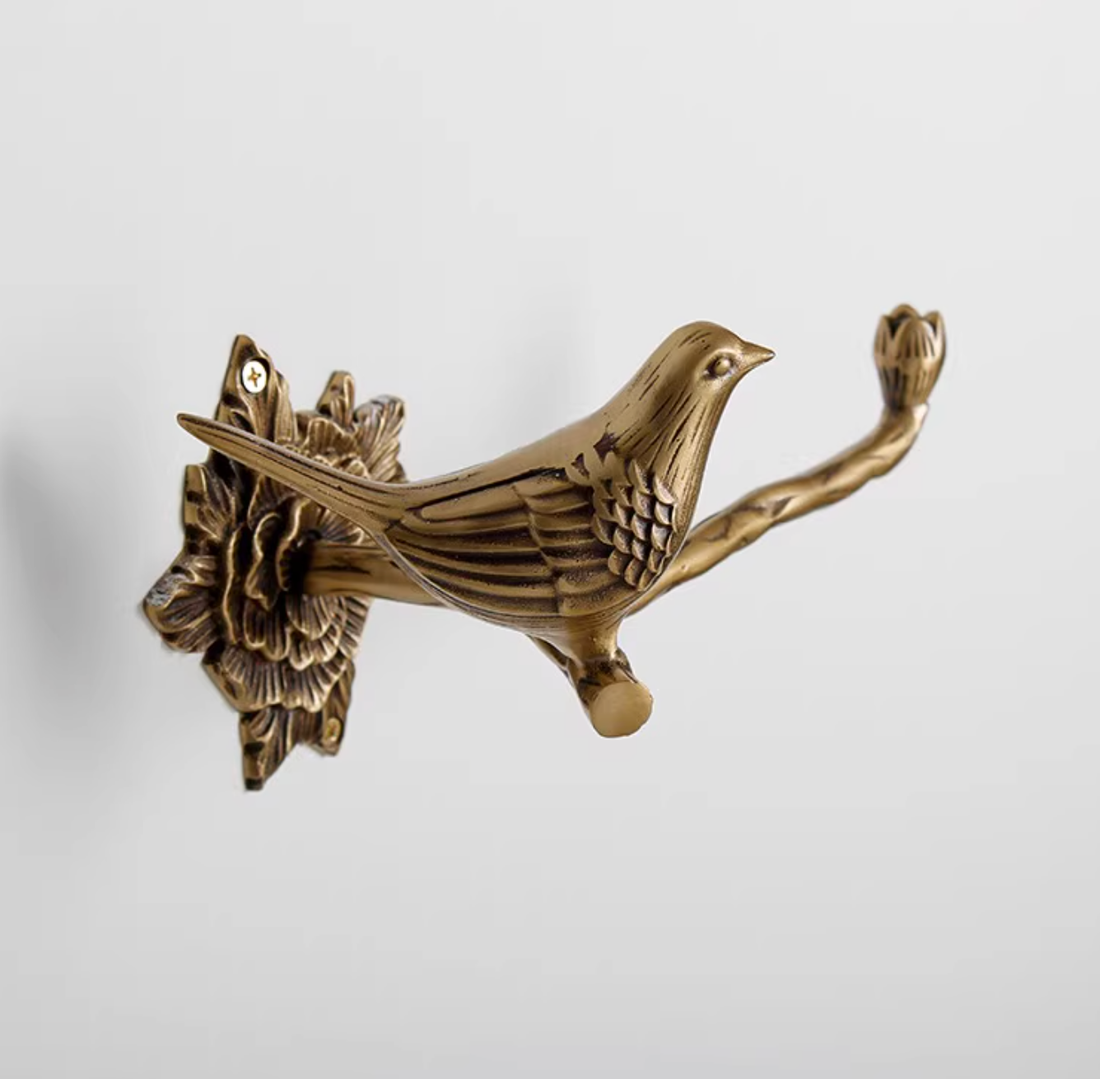 Brass bird towel rack for home decor, part of the Brass Bird Bathroom Set.