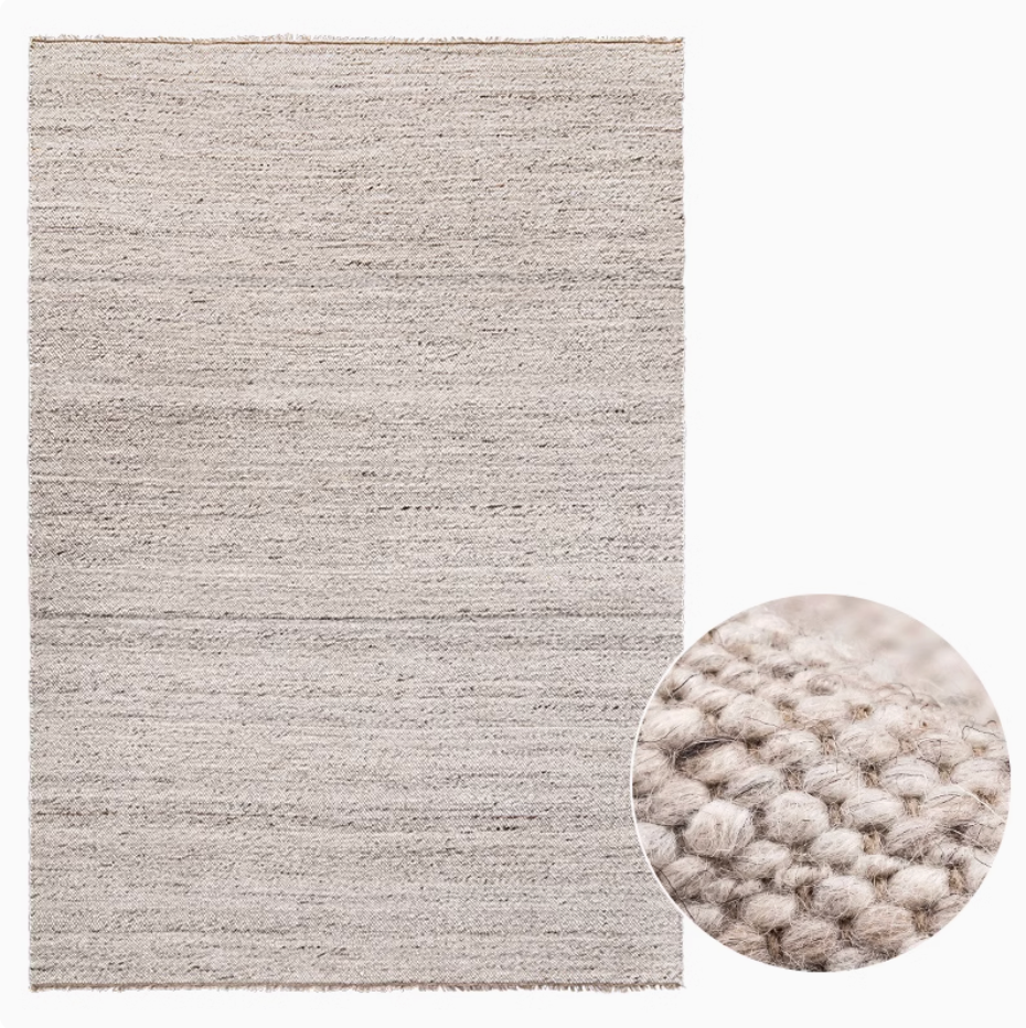 Natural Wool Carpet in light grey with textured weave. Home Decor essential.
