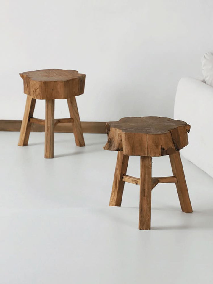 Elm Solid Wood Stool: rustic, natural wood slice top with wooden tripod legs in a minimalist room.