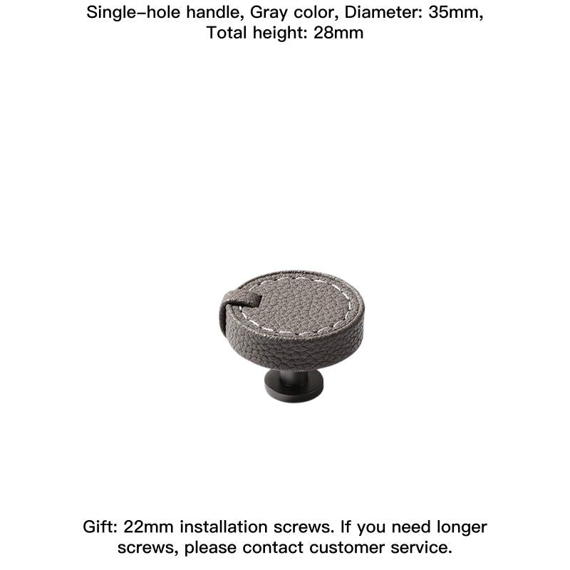 Gray leather round drawer pull with white stitching and black base. Decorative leather knob.