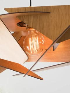 Geometric Wood Lamp with warm Edison bulb, natural wood tones, modern home decor.