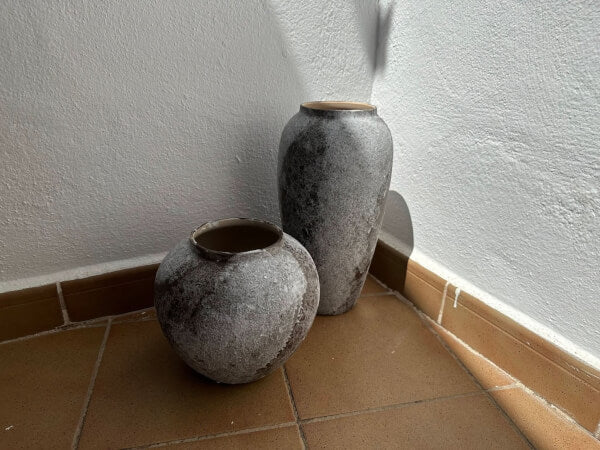 Antique Effect Ceramic Vase: Textured stoneware in gray and white, perfect for rustic farmhouse decor.