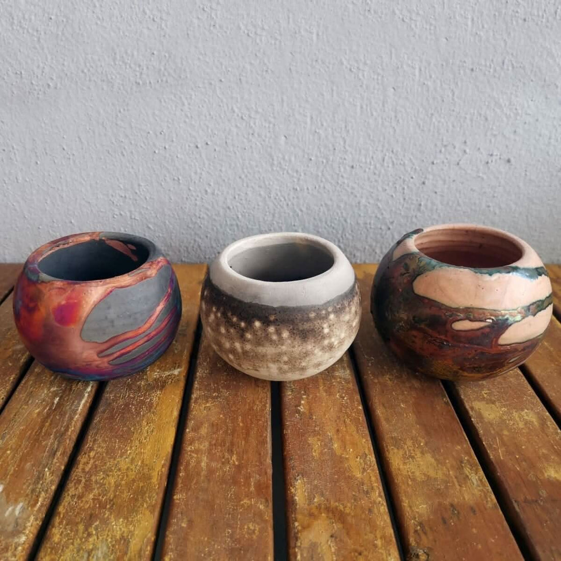 RAAQUU Tsuchi Ceramic Raku Pottery Planter Pot Mixed Finish Set of 3, three spherical rustic pots.