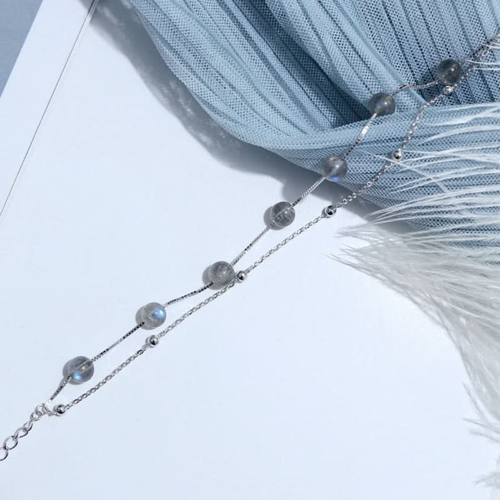 Delicate Moonstone bracelet s925 silver with shimmering grey beads on a delicate chain.