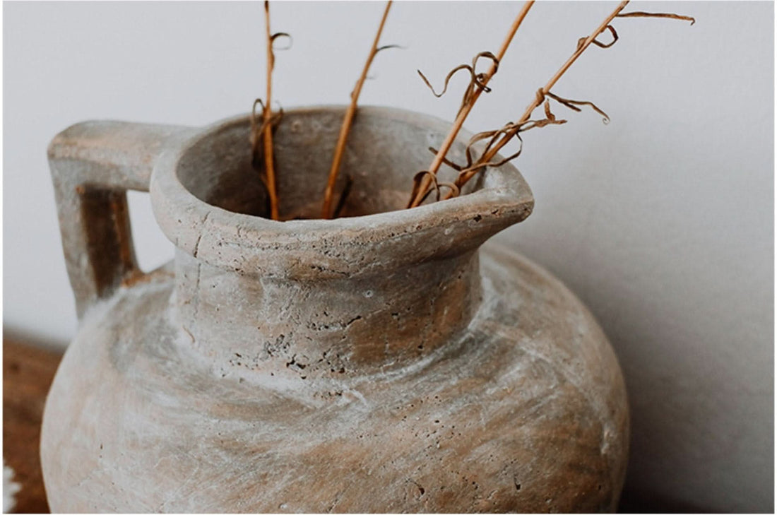 Distressed, raw earthenware Antique Style Succulent Clay Pot with dried reeds, rustic farmhouse decor.