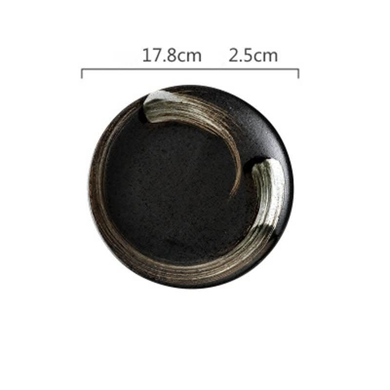 Black ceramic bowl with rustic glaze and metallic brush strokes. Dinnerware.