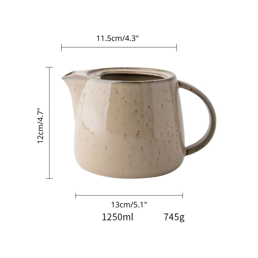 Light beige ceramic pitcher utensil holder with farmhouse style and speckle finish.