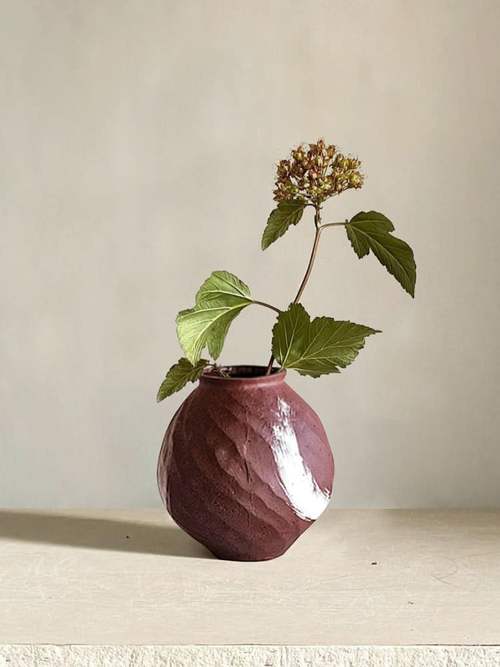 Brown Vase With a Brushed Stroke, a textured ceramic home decor piece with a white brushstroke accent.
