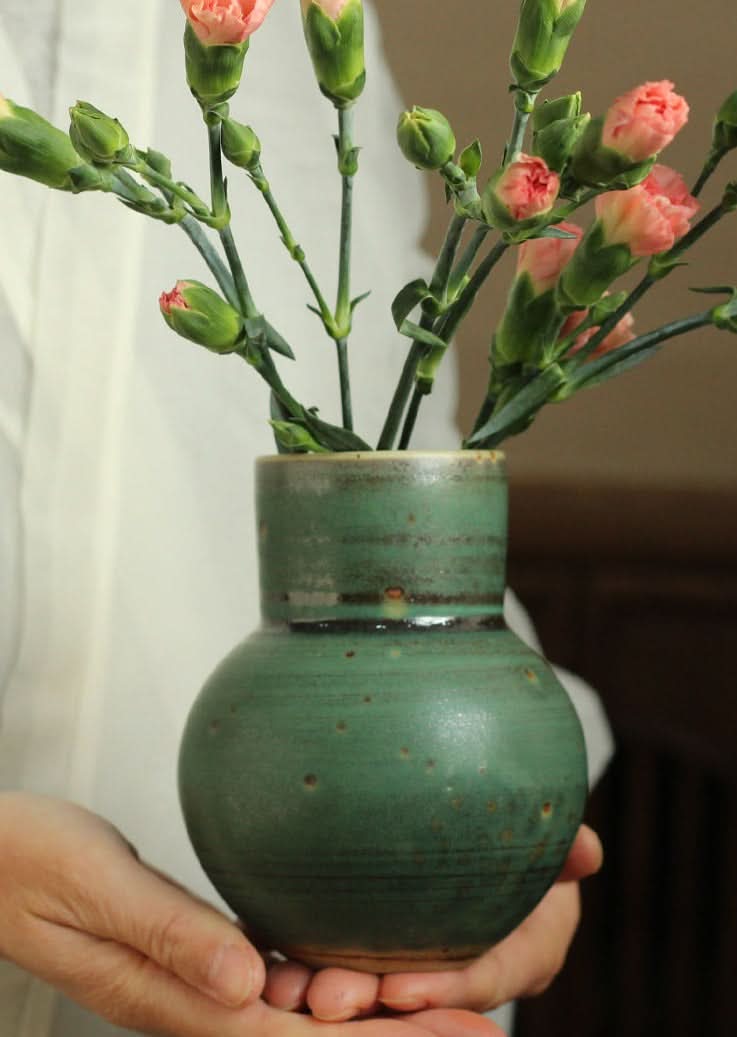 Small sage green ceramic vase for flowers, rustic home decor.
