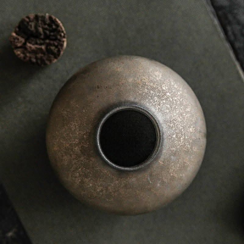Household Simple Retro Tea Ceramic Airtight Jar, rustic textured stoneware with dark opening, home decor.