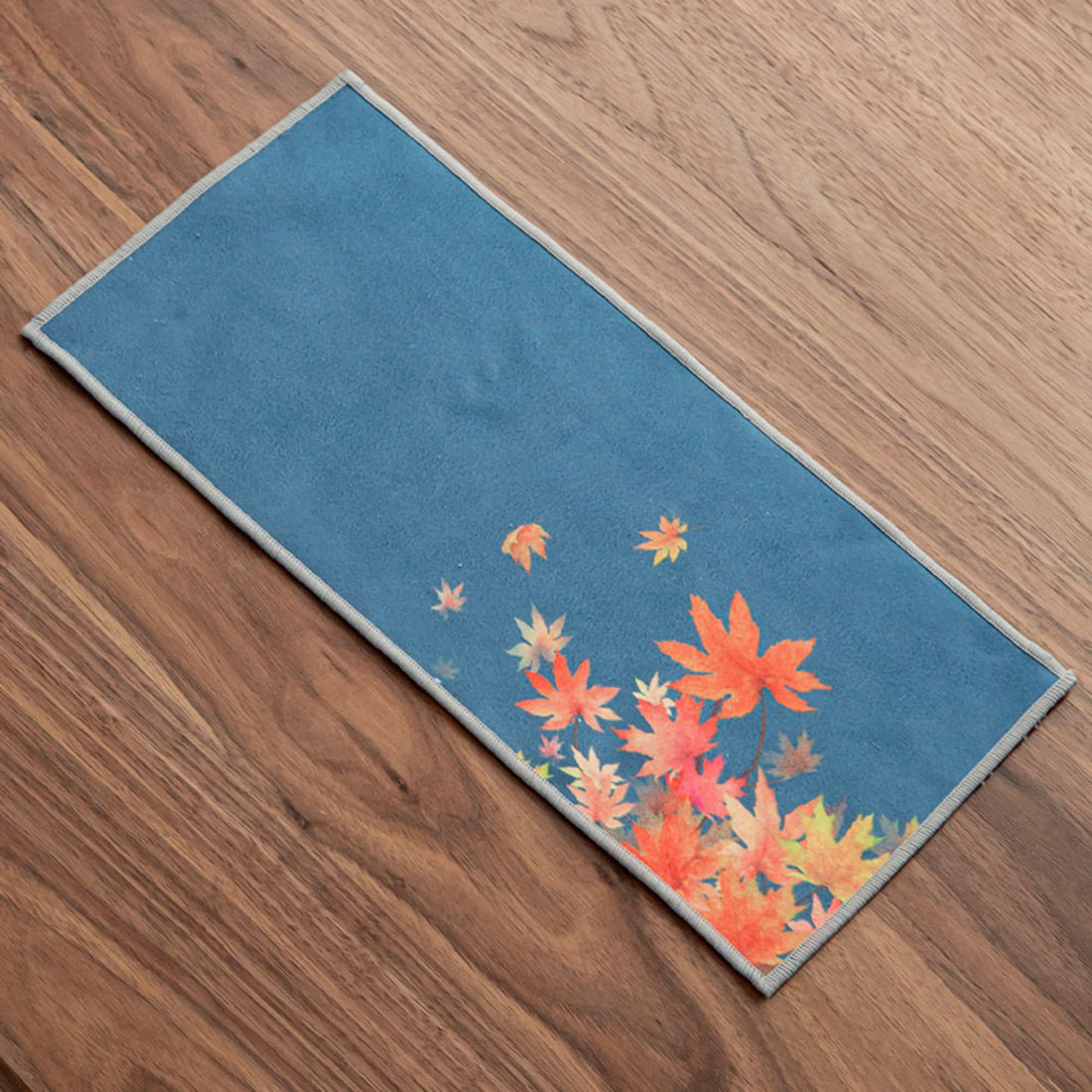Blue Japanese tea towel with Ukiyo-e style autumn leaves.