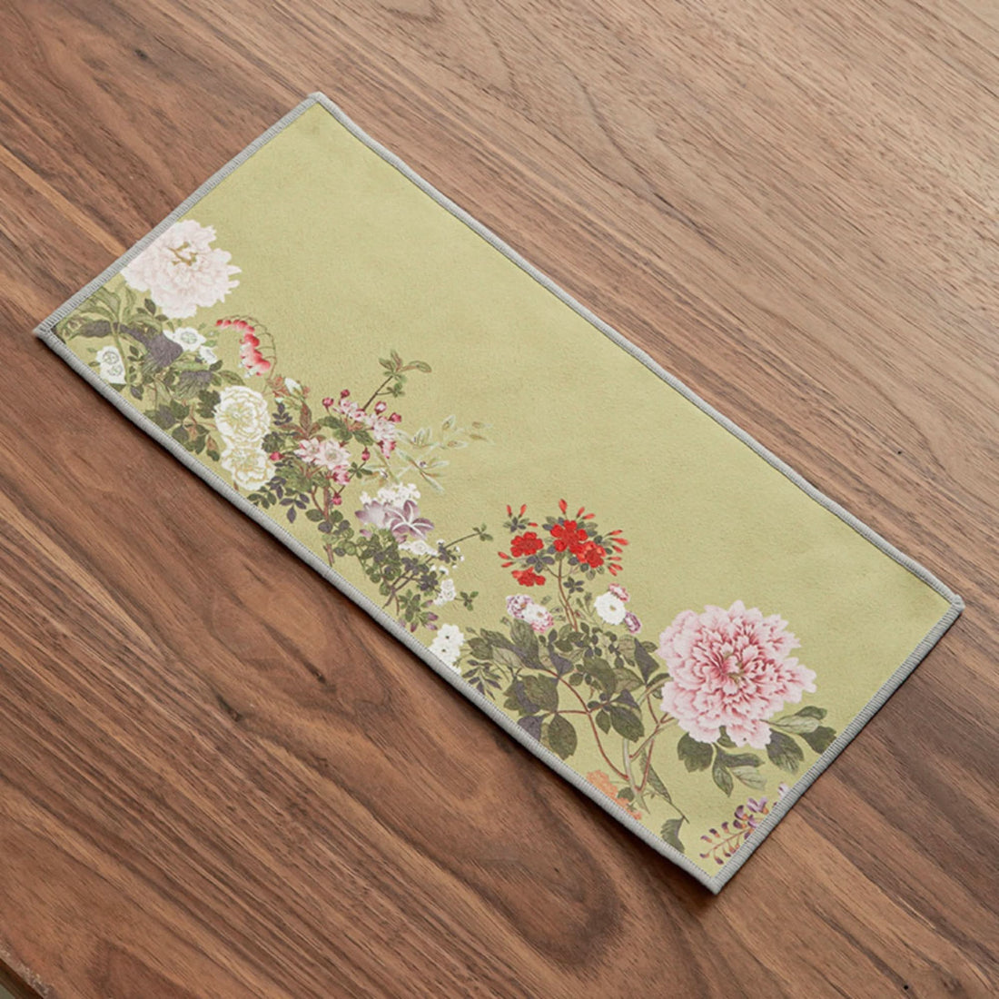 Ukiyo-e style Japanese tea towel in green with floral print, perfect for tea ceremonies.