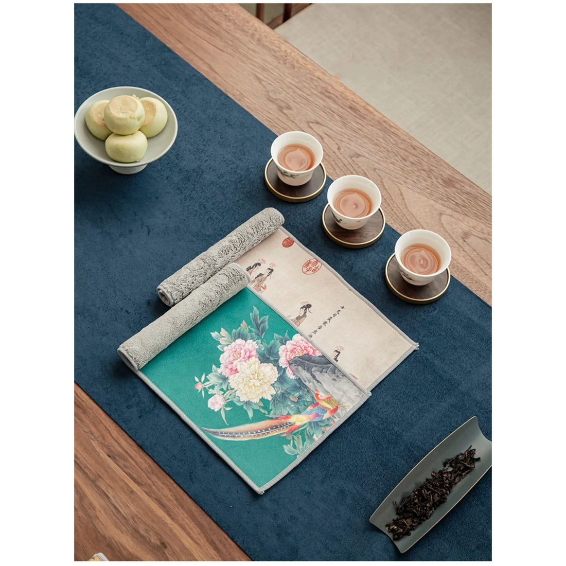 Japanese tea towels with Ukiyo-e bird and floral prints, set for a tea ceremony.