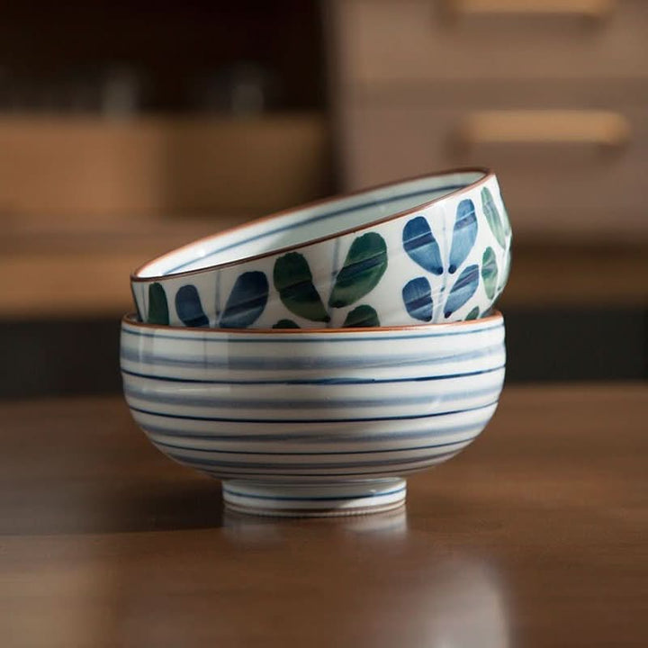 Japan Imported Ceramic Tableware Lushan Painted Round Bowls set on wooden table.