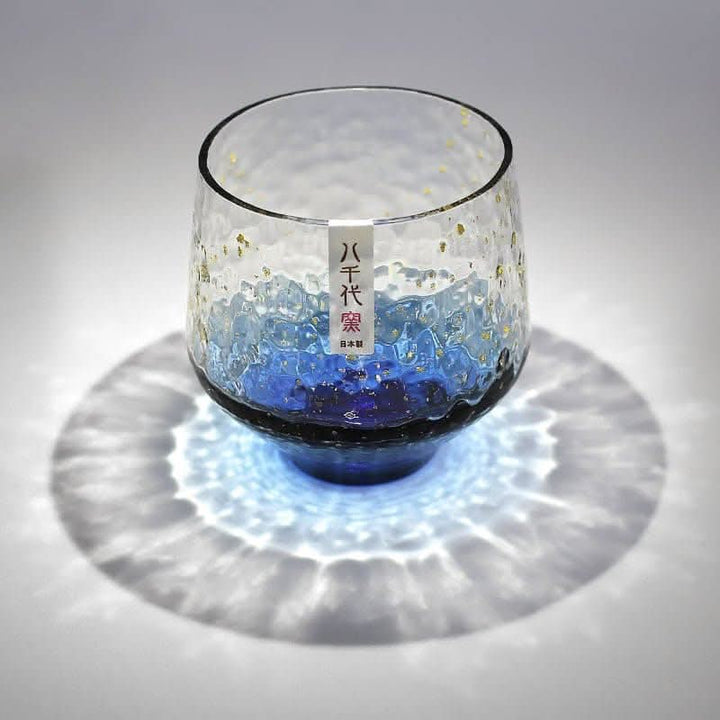 Japan Imported Hand-Made Colored Glass Cup, blue ombre with gold flecks, textured, casts rippling light.