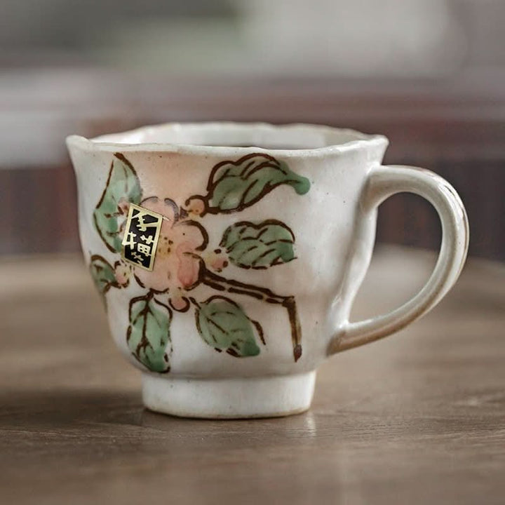Japan Imported Mino Burning Tang Grass Cherry Blossom 8.45oz ceramic mug with floral design.
