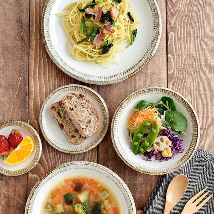 Japan imported Mino Ware Beige Dish Set with pasta, salad, soup, bread, and fruit.