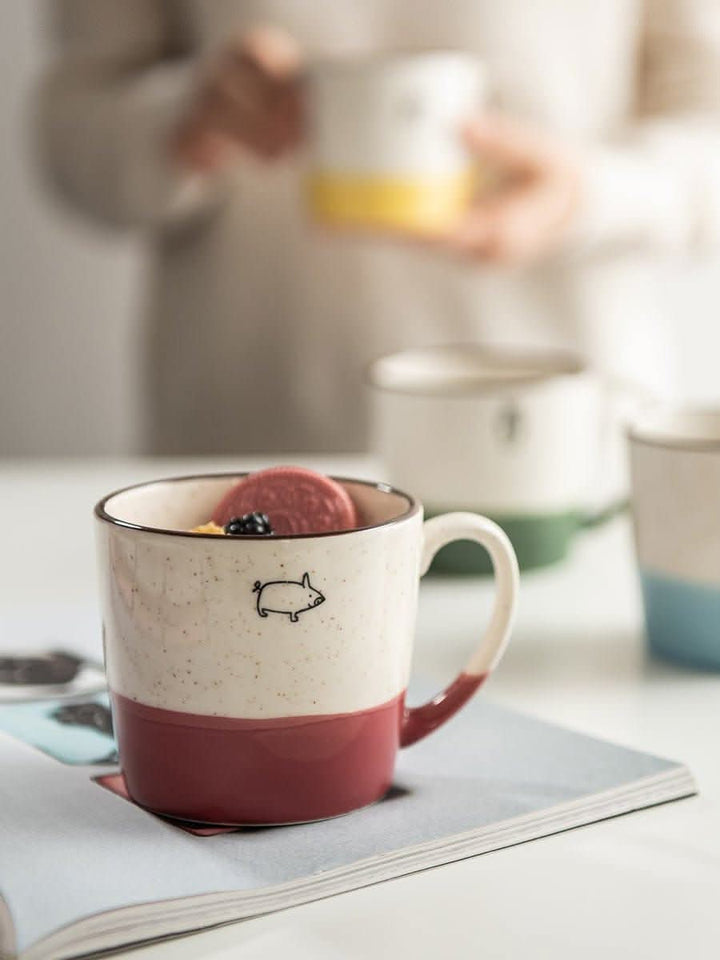 Japan imported Minoyaki pig mug, ceramic, beige and red, with animal designs.