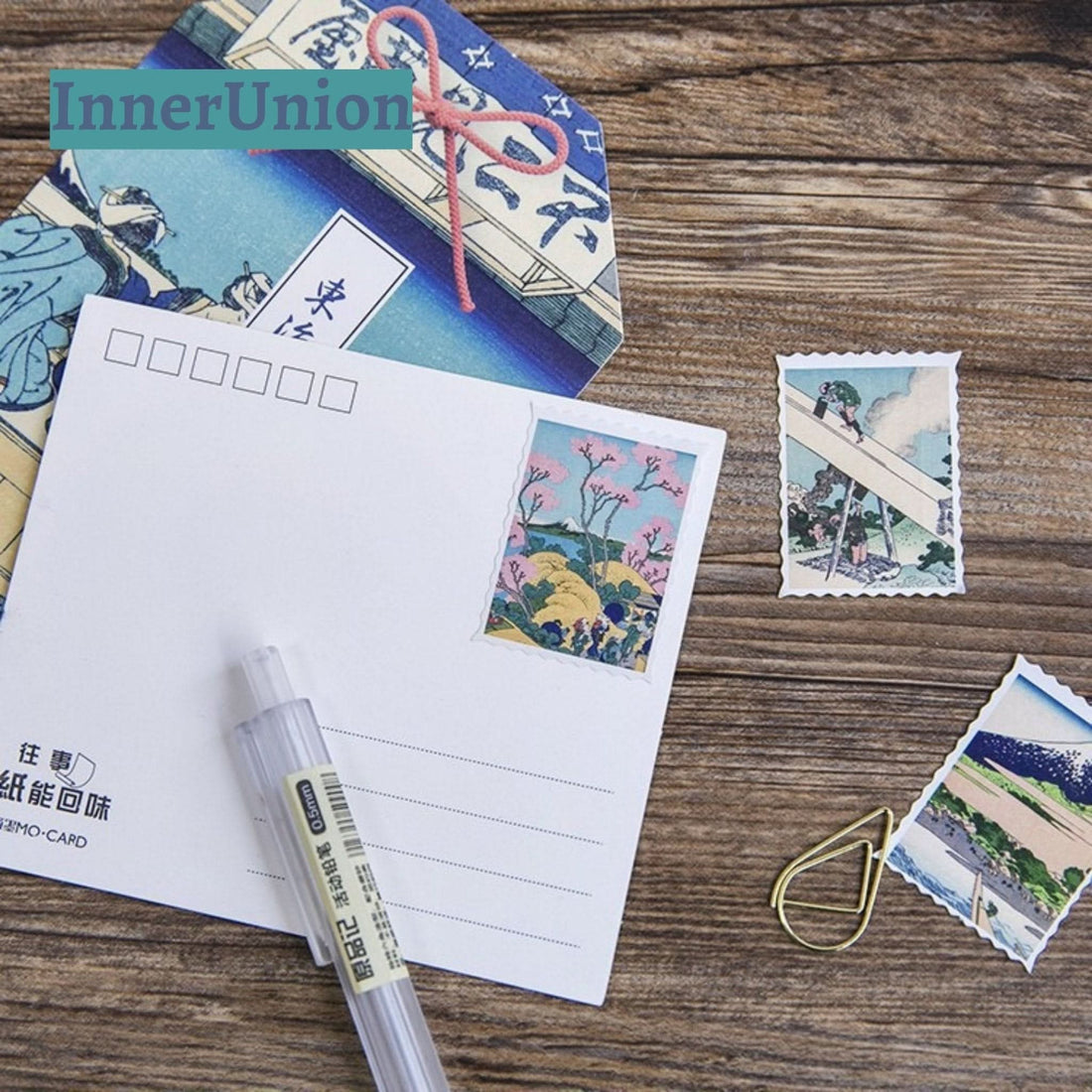 Japanese Postcard Stickers with Katsuchika Hokusai art, on wooden background.