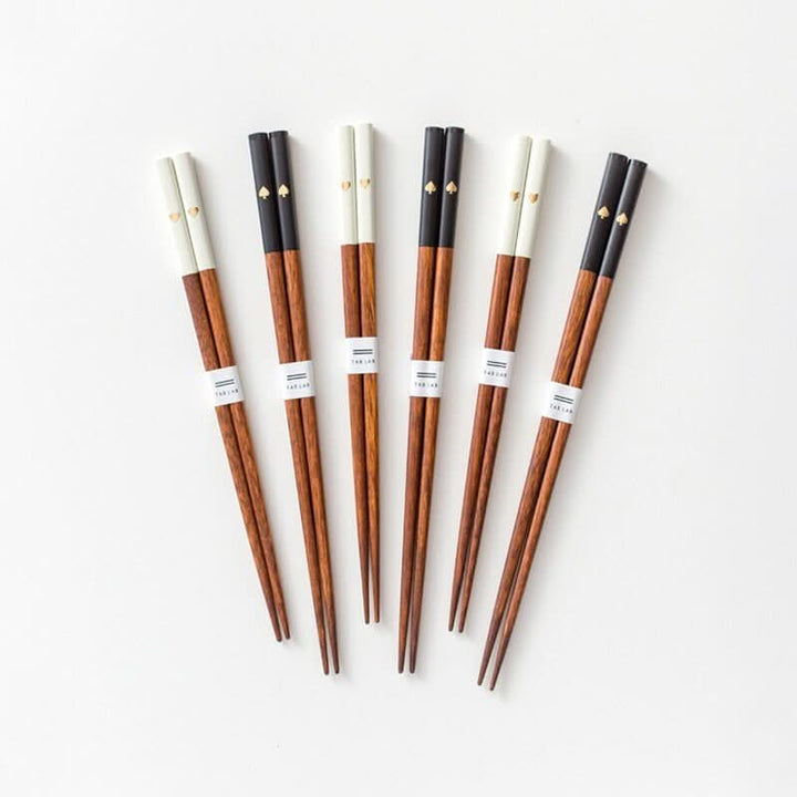Japanese Solid Wood Peach Heart Chopsticks set in black and white, with gold spade detail.