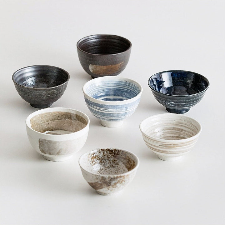 Japanese Minoyaki handmade ceramic bowls: rice, soup, salad. Earthy tones and blues.