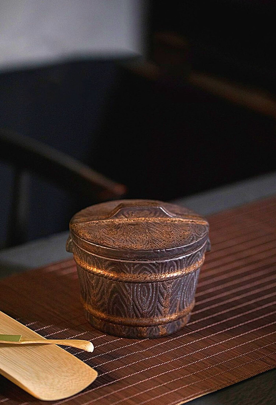Vintage Japanese tea jar, dark brown pottery with ornate detailing, perfect for tea, coffee, or spices.