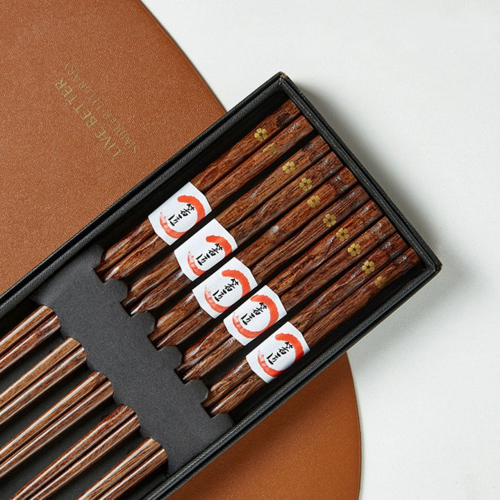 Dark wood chopsticks with gold cherry leaf pattern, set of 5, in a gift box.