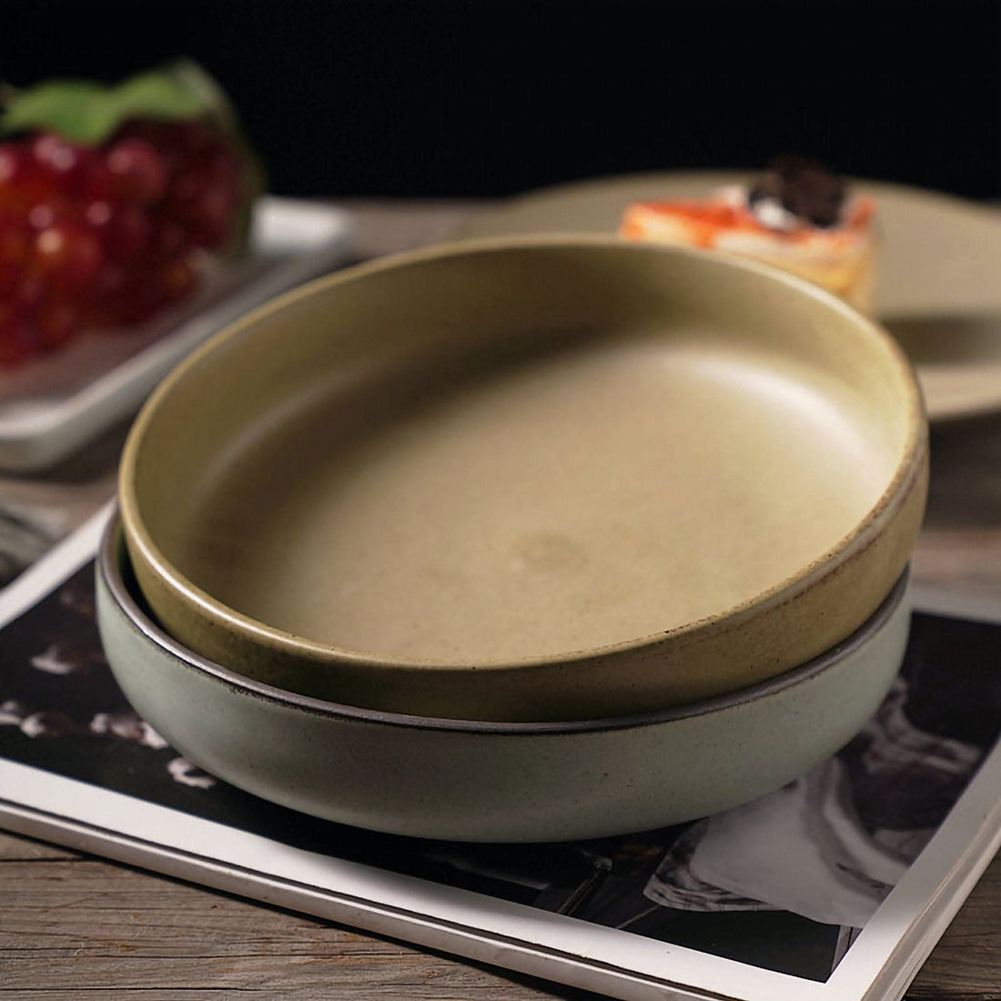 Shallow plates with earthy colors, ceramic dishes, salad bowl.