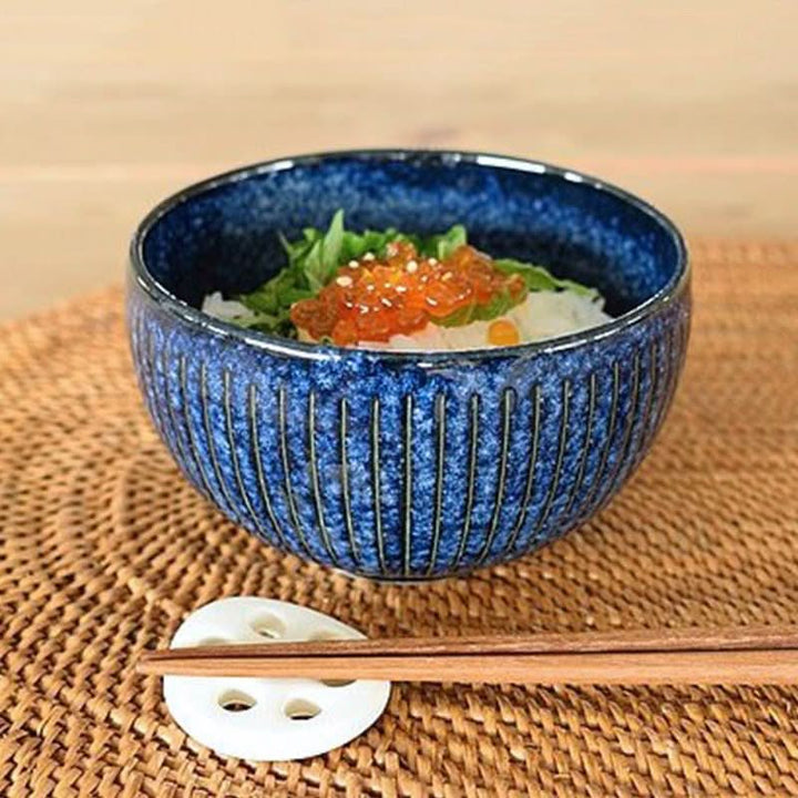Blue stoneware soup bowl (11.16oz) with Japanese food & chopsticks on woven placemat.