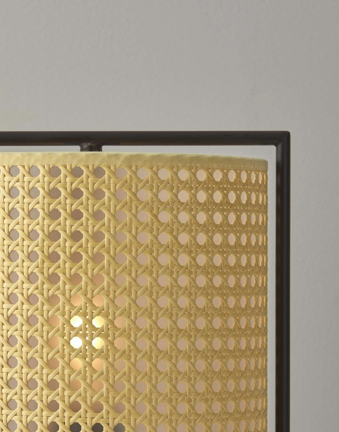 Tall Cane Shade Table Lamp with woven natural material and dark metal frame.
