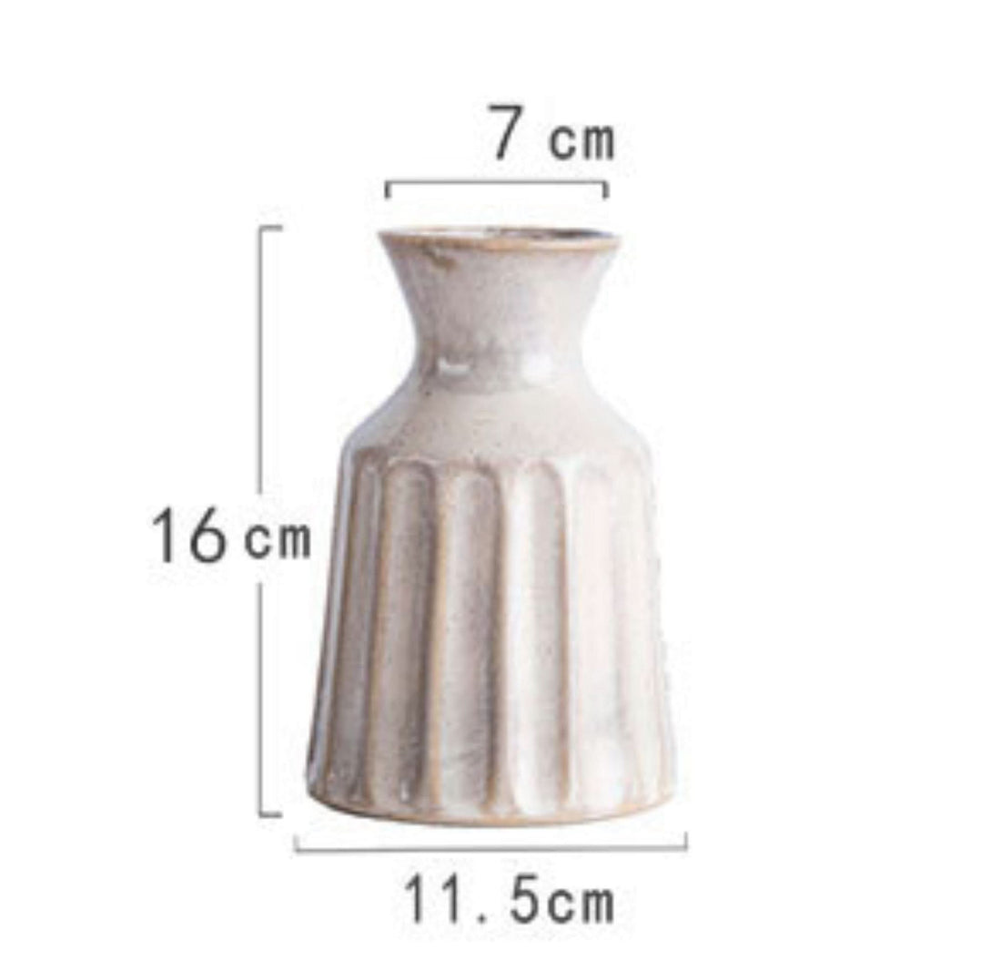 White ceramic small vase, fluted design, 16cm tall. Home decor.