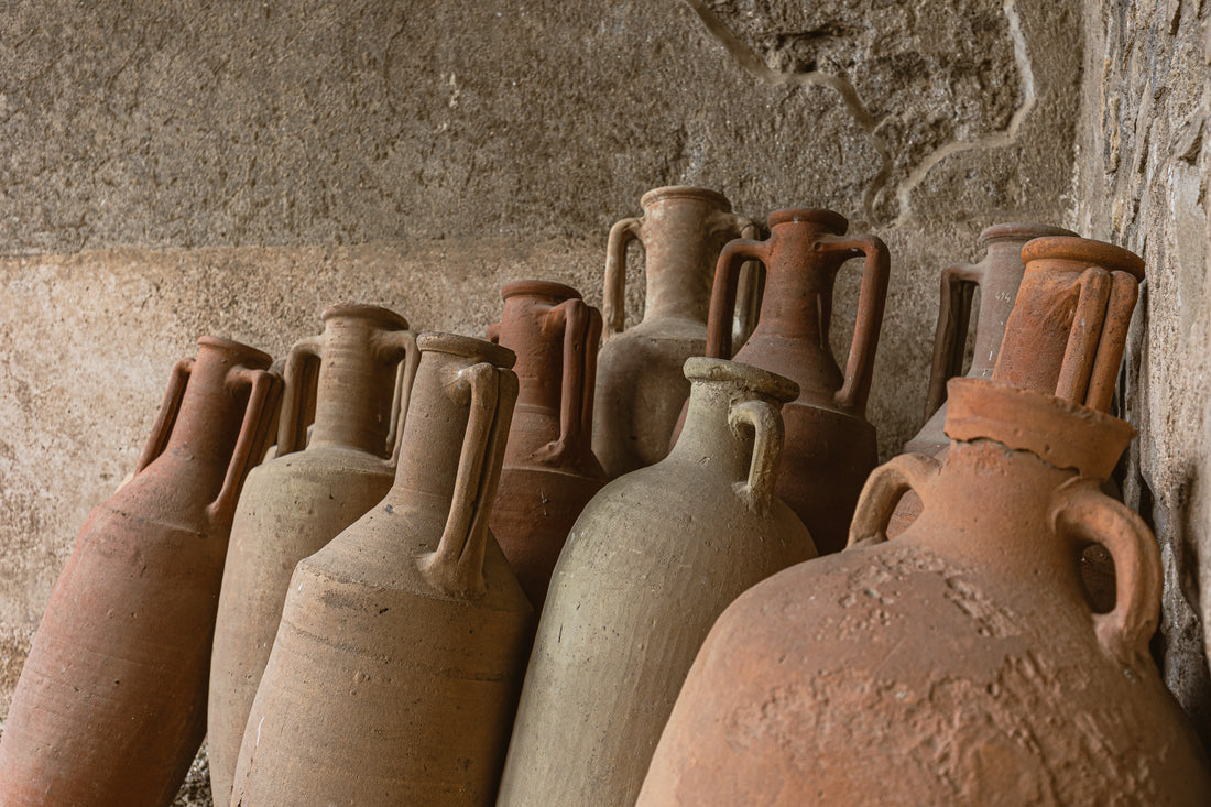 Photo by James Frid: https://www.pexels.com/photo/ancient-jugs-near-stone-wall-14754631/