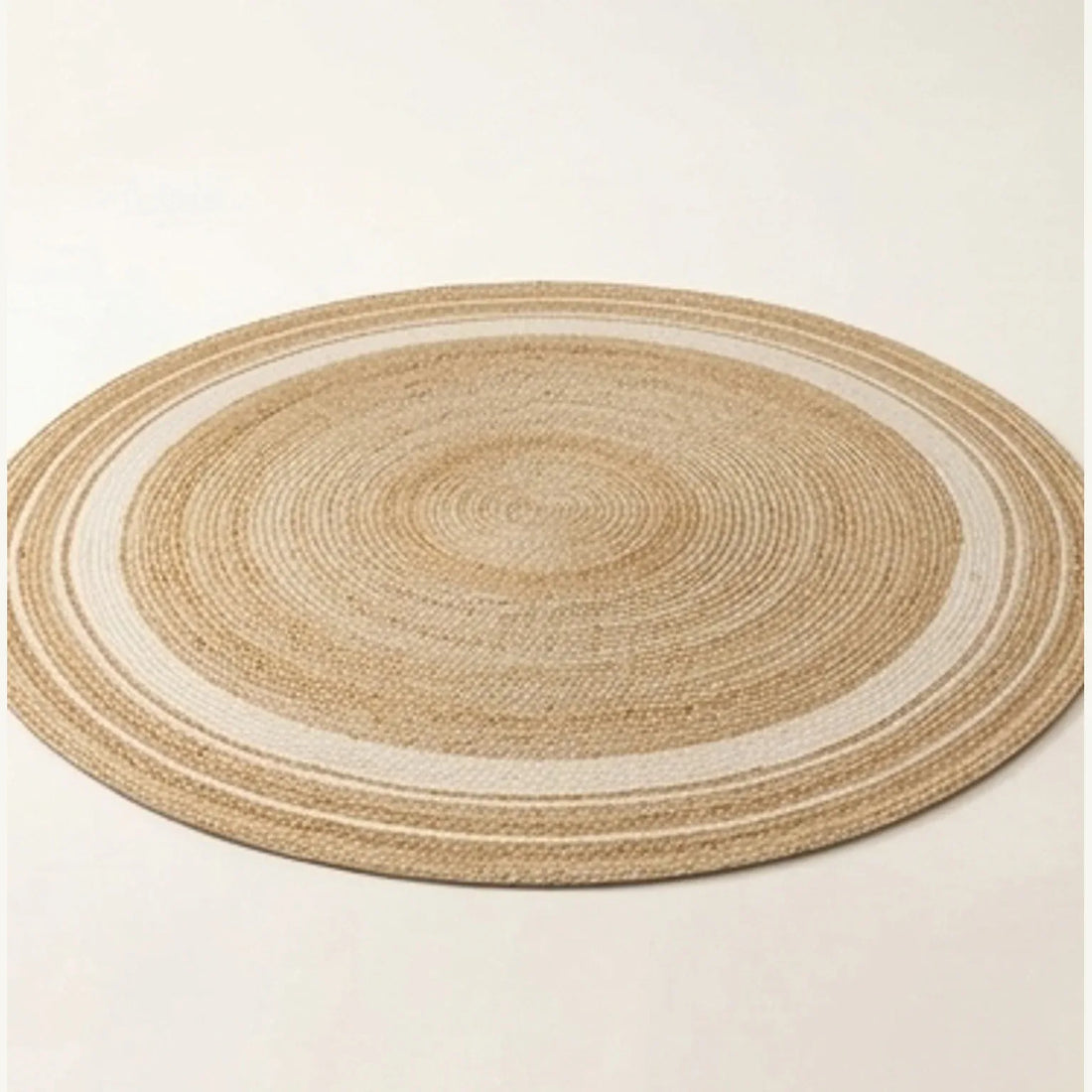Round Jute Rug — studio warm-white background product shot