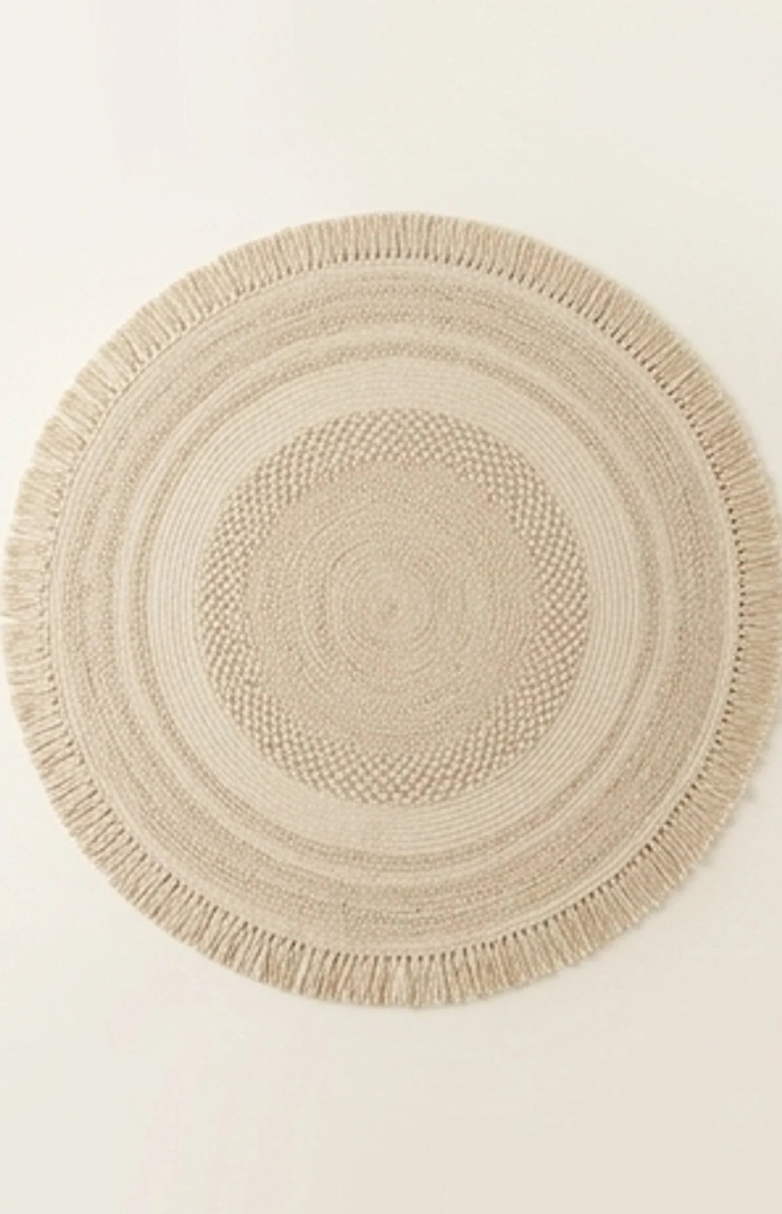 Round Wool Braided Rug — studio warm-white background product shot