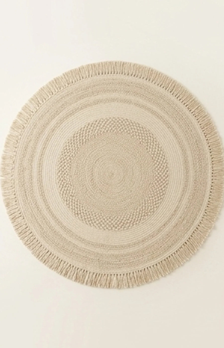 Round Wool Braided Rug — studio warm-white background product shot