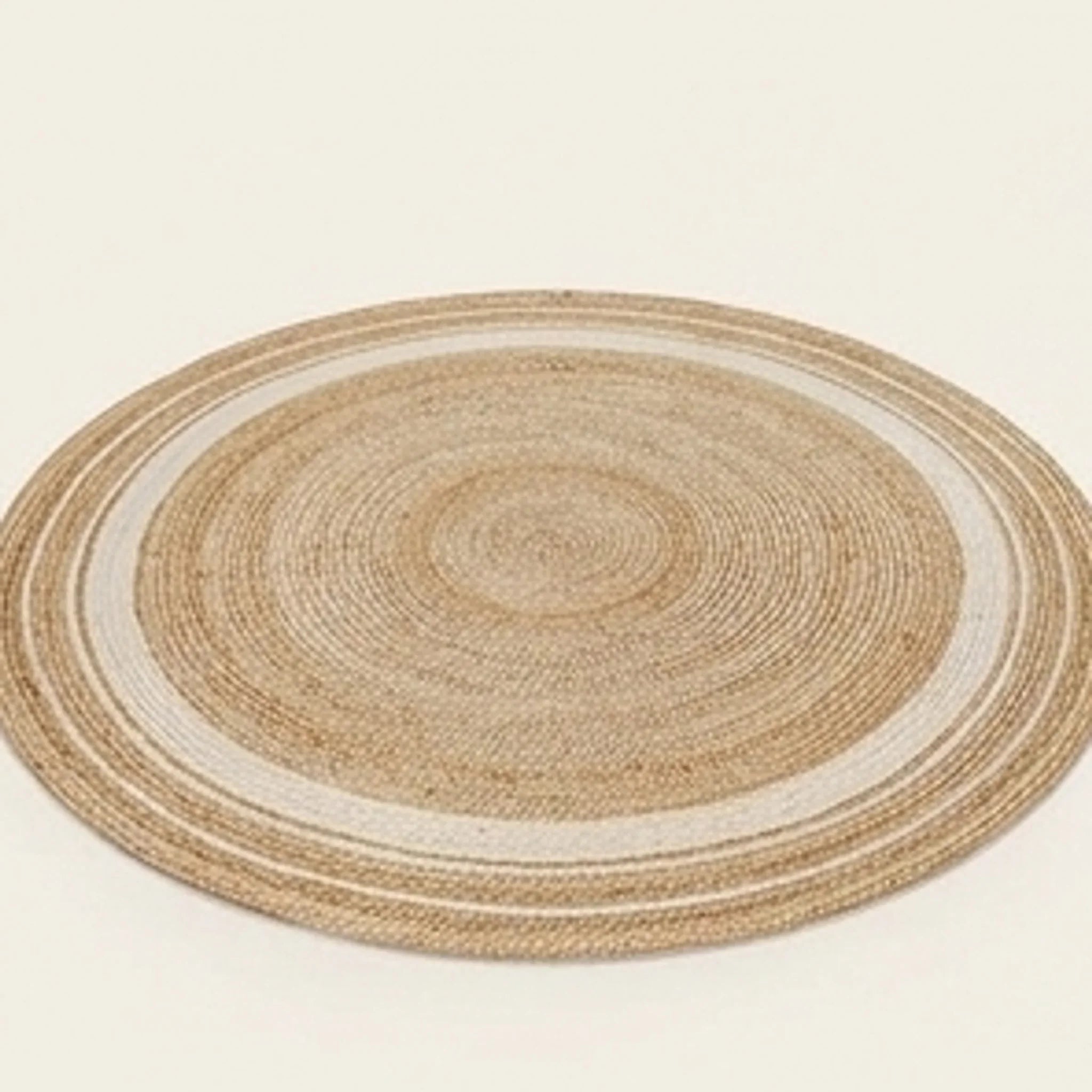 Round Jute Rug — studio warm-white background product shot