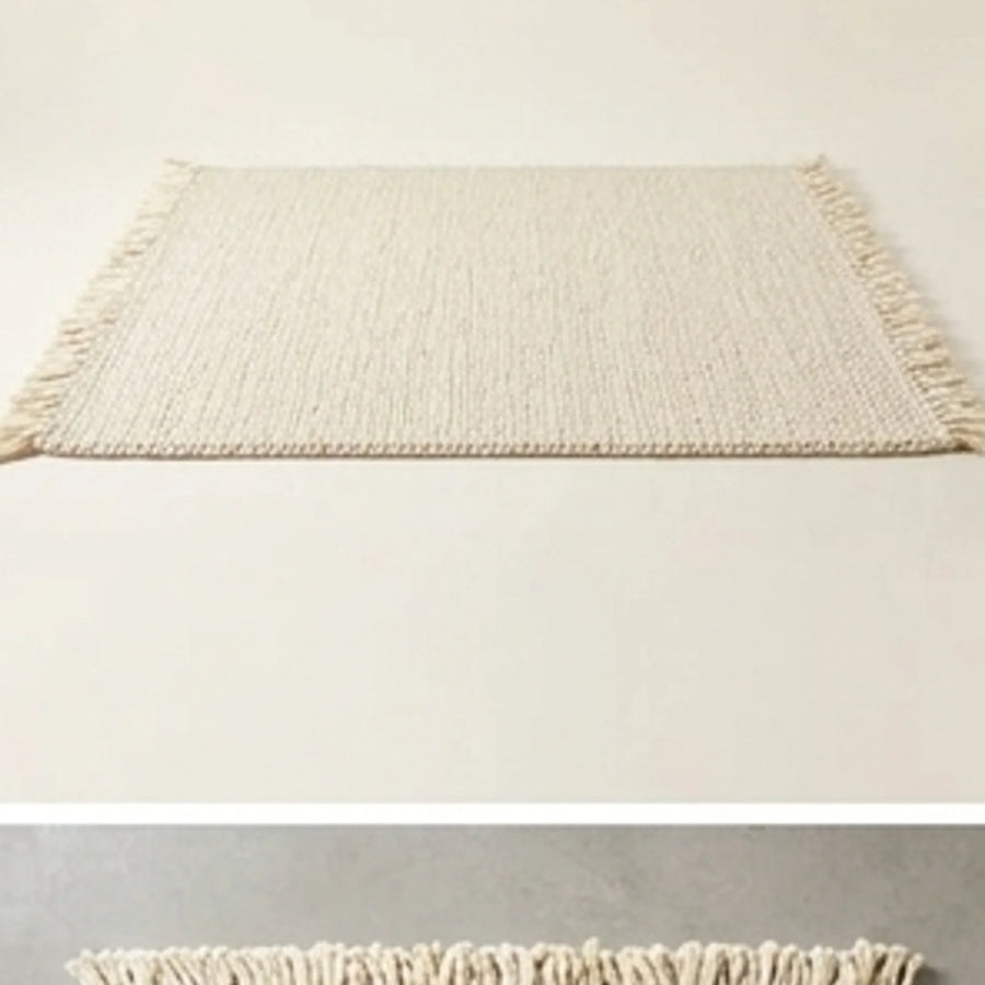 Braided Wool Rug — studio warm-white background product shot