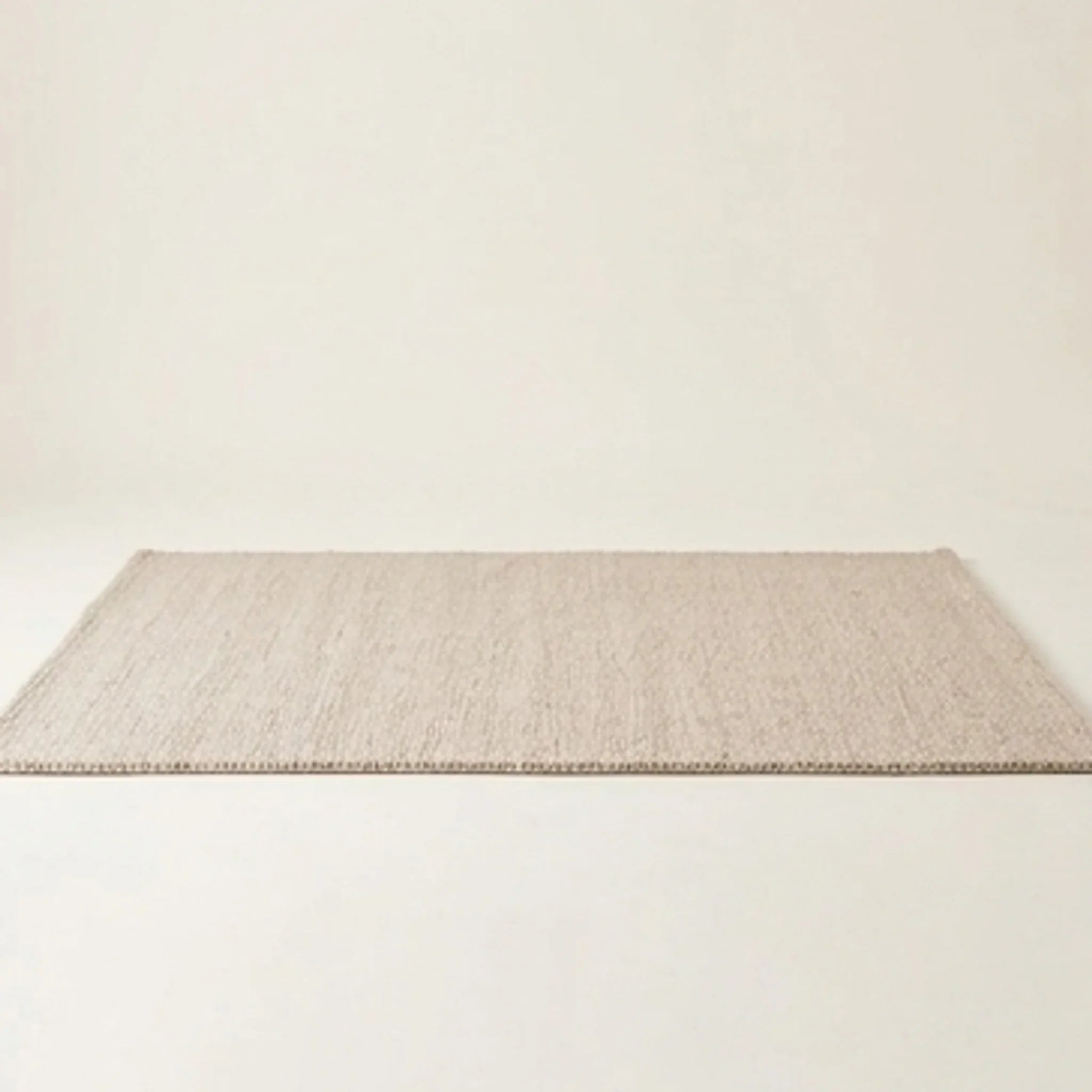 Natural Handwoven New Zealand Wool Rug — studio warm-white background product shot