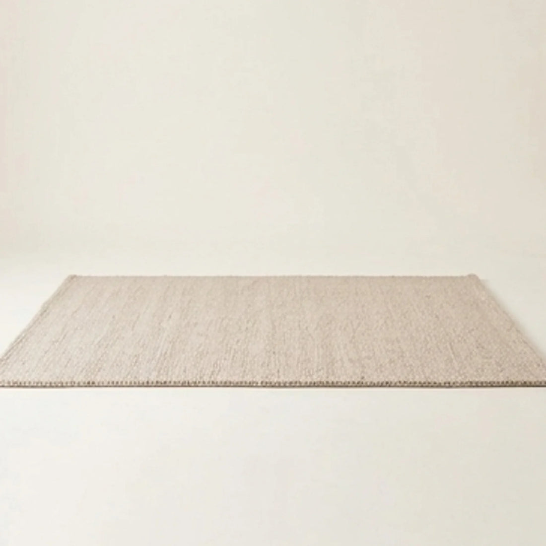 Natural Handwoven New Zealand Wool Rug — studio warm-white background product shot