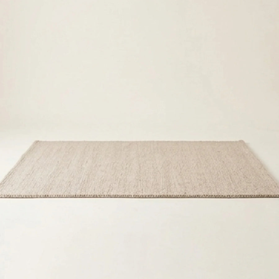 Natural Handwoven New Zealand Wool Rug — studio warm-white background product shot