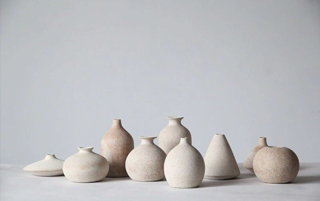 Cream ceramic vases, various shapes.