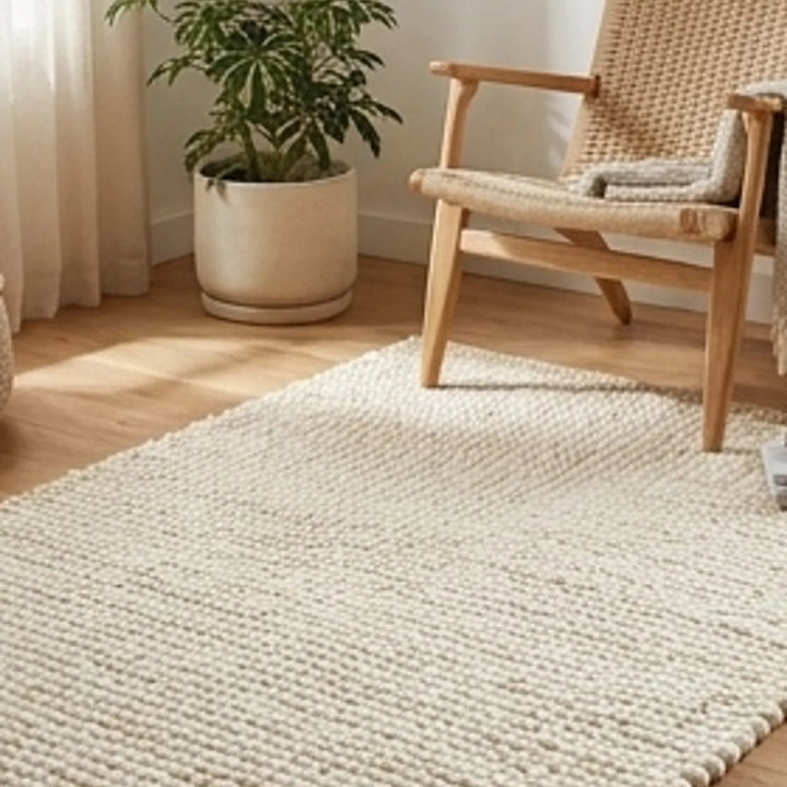 Wool Handwoven Cream Rug — lifestyle scene with natural props